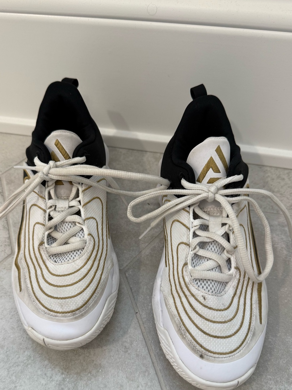Nike Black & White Sneakers with Gold Accent